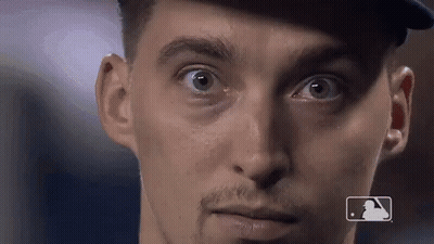 A Close Up Of A Man 'S Face With A Mlb Logo On The Bottom GIF