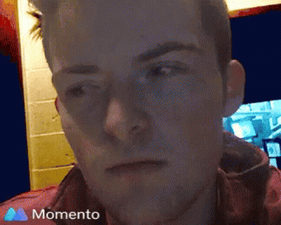 A Close Up Of A Man 'S Face With A Momento Icon In The Corner GIF