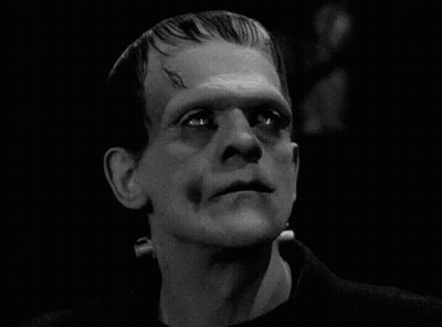 A Close Up Of A Man 'S Face With A Monster 'S Head . GIF