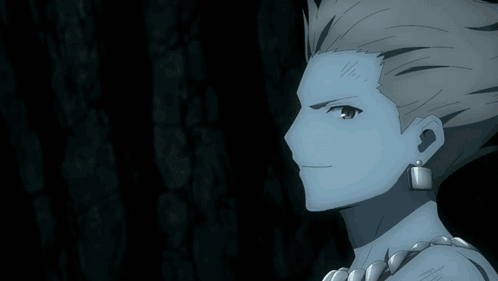 A Close Up Of A Man 'S Face With A Necklace Around His Neck GIF