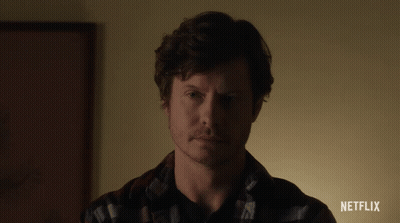 A Close Up Of A Man 'S Face With A Netflix Advertisement In The Corner GIF
