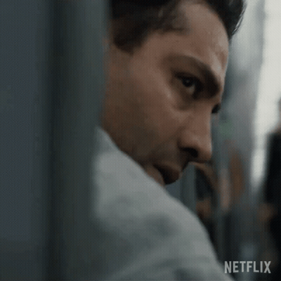 A Close Up Of A Man 'S Face With A Netflix Logo In The Background . GIF