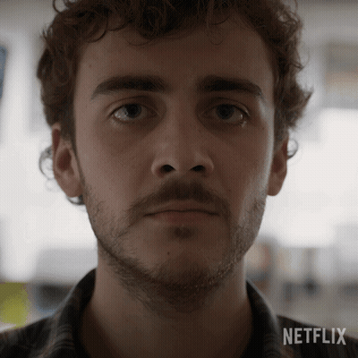 A Close Up Of A Man 'S Face With A Netflix Logo On The Bottom GIF