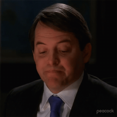 A Close Up Of A Man 'S Face With A Peacock Logo In The Corner GIF