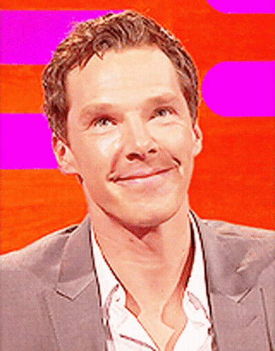 A Close Up Of A Man 'S Face With A Pink Background GIF