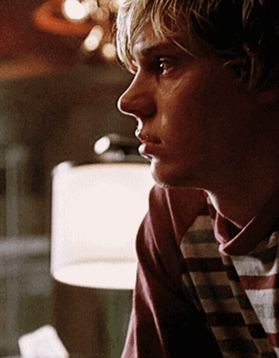 A Close Up Of A Man 'S Face With A Plaid Shirt On GIF