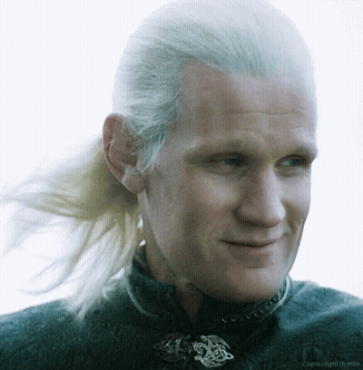 A Close Up Of A Man 'S Face With A Ponytail And The Words Coparolight Tumblr Below Him GIF