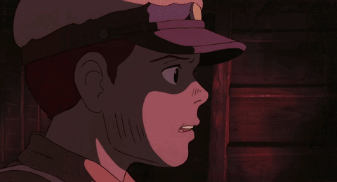 A Close Up Of A Man 'S Face With A Purple Hat On GIF