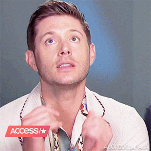 A Close Up Of A Man 'S Face With A Red Access / Star Sticker GIF