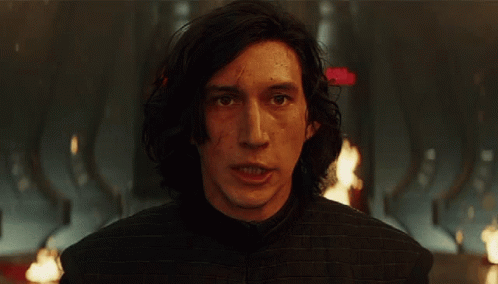 A Close Up Of A Man 'S Face With A Red Arrow Pointing At Him GIF