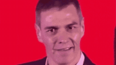 A Close Up Of A Man 'S Face With A Red Background And A Smile On His Face . GIF