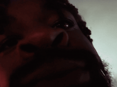 A Close Up Of A Man 'S Face With A Red Eye GIF