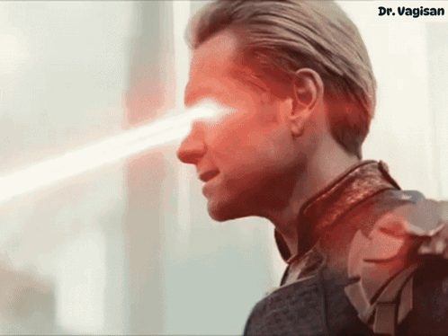 A Close Up Of A Man 'S Face With A Red Light Coming Out Of His Eye And The Words Dr. Vagin On The Bottom GIF