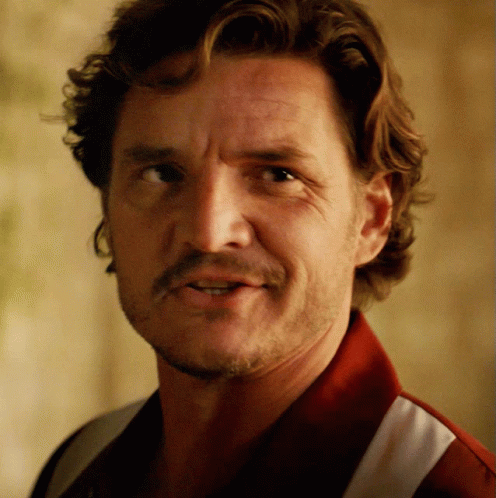 A Close Up Of A Man 'S Face With A Red Shirt On GIF