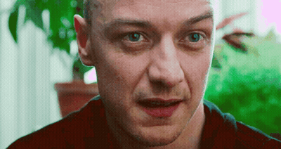 A Close Up Of A Man 'S Face With A Red Shirt On GIF