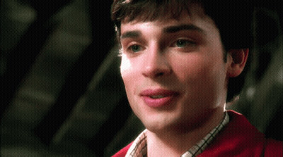 A Close Up Of A Man 'S Face With A Red Shirt GIF