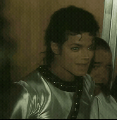 A Close Up Of A Man 'S Face With A Reflection In The Mirror GIF
