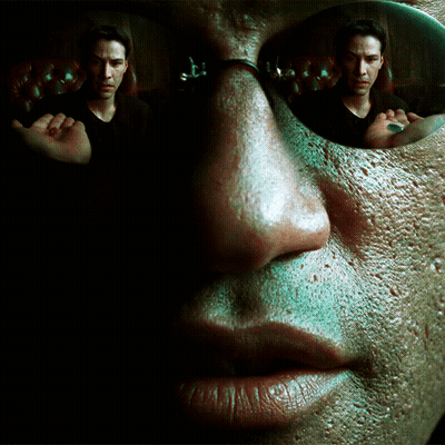 A Close Up Of A Man 'S Face With A Reflection Of Another Man GIF