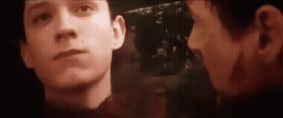 A Close Up Of A Man 'S Face With A Reflection Of Another Man . GIF