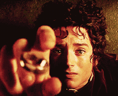 A Close Up Of A Man 'S Face With A Ring In His Finger GIF