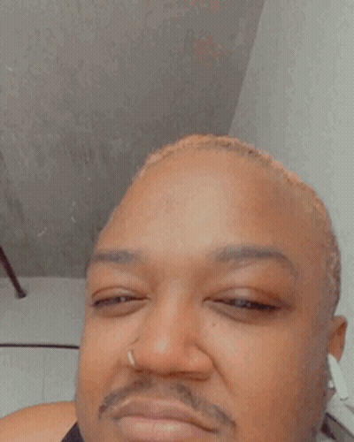 A Close Up Of A Man 'S Face With A Ring In His Nose GIF