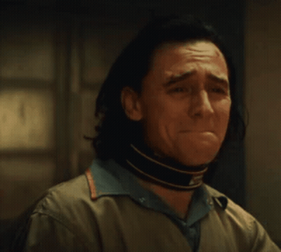 A Close Up Of A Man 'S Face With A Scar On His Forehead And A Choker Around His Neck . GIF