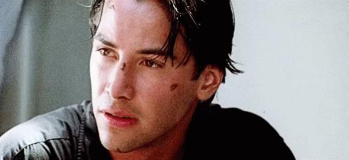 A Close Up Of A Man 'S Face With A Scratch On His Forehead Looking At The Camera . GIF