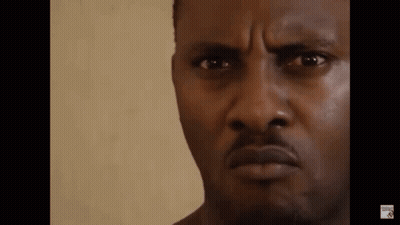 A Close Up Of A Man 'S Face With A Serious Expression . GIF