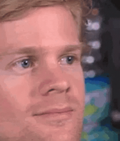 A Close Up Of A Man 'S Face With A Serious Expression . GIF