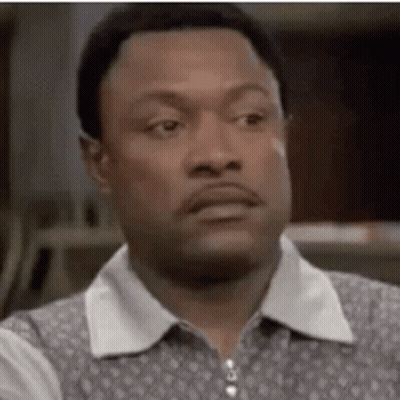 A Close Up Of A Man 'S Face With A Serious Expression . GIF