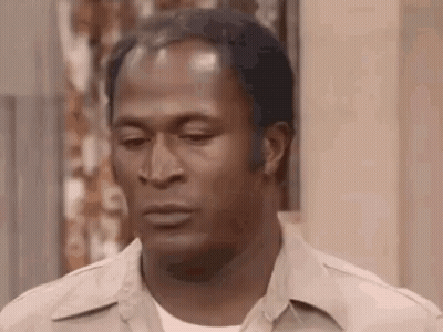 A Close Up Of A Man 'S Face With A Serious Expression . GIF