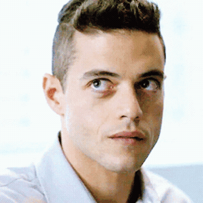 A Close Up Of A Man 'S Face With A Serious Look On His Face . GIF
