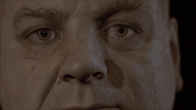 A Close Up Of A Man 'S Face With A Serious Look On His Face GIF
