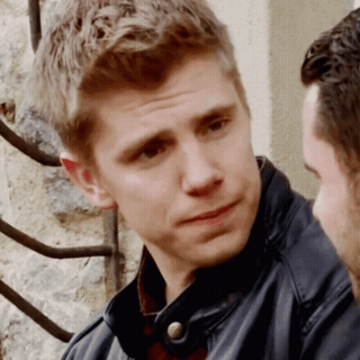 A Close Up Of A Man 'S Face With A Serious Look On His Face GIF