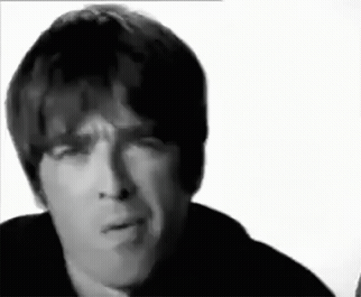 A Close Up Of A Man 'S Face With A Serious Look On His Face In A Black And White Photo . GIF