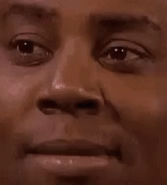 A Close Up Of A Man 'S Face With A Serious Look On It . GIF