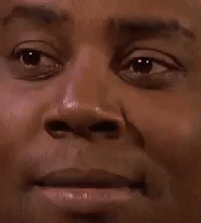A Close Up Of A Man 'S Face With A Serious Look On It . GIF
