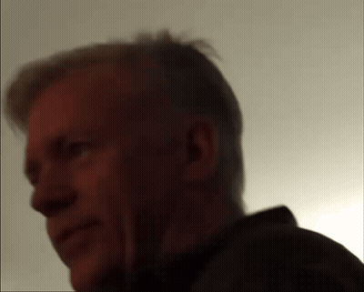 A Close Up Of A Man 'S Face With A Shadow On His Face GIF