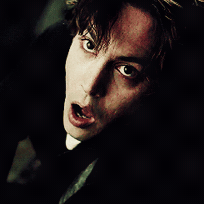 A Close Up Of A Man 'S Face With A Shocked Look On His Face GIF