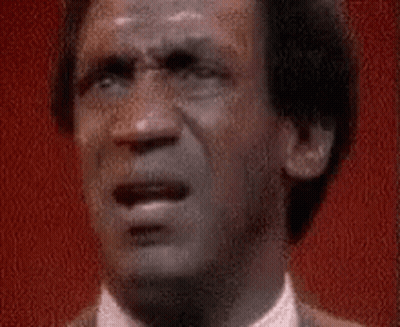 A Close Up Of A Man 'S Face With A Shocked Look On His Face . GIF