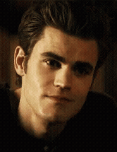 A Close Up Of A Man 'S Face With A Slight Smile . GIF