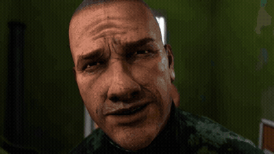 A Close Up Of A Man 'S Face With A Slight Smirk On It GIF