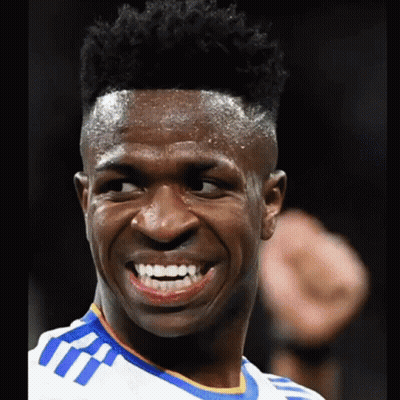 A Close Up Of A Man 'S Face With A Smile On His Face GIF
