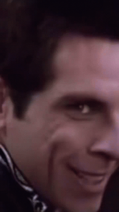 A Close Up Of A Man 'S Face With A Smile On His Face GIF