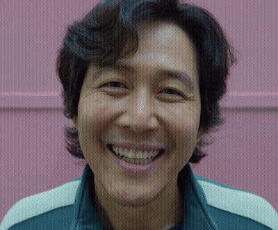 A Close Up Of A Man 'S Face With A Smile On His Face GIF