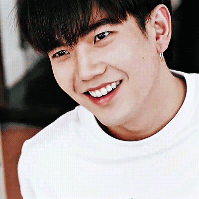 A Close Up Of A Man 'S Face With A Smile On His Face GIF