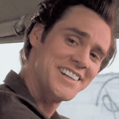 A Close Up Of A Man 'S Face With A Smile On It GIF
