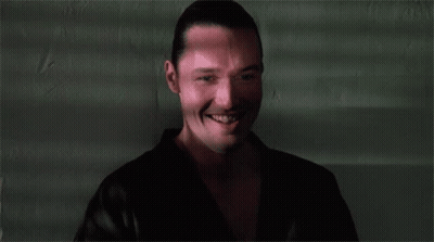 A Close Up Of A Man 'S Face With A Smile On It GIF