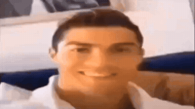 A Close Up Of A Man 'S Face With A Smile On It . GIF