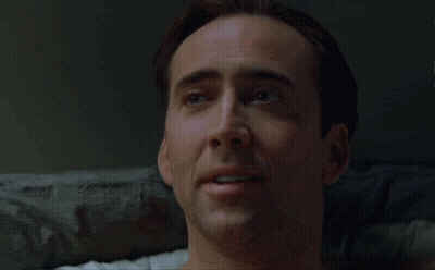 A Close Up Of A Man 'S Face With A Smile On It GIF